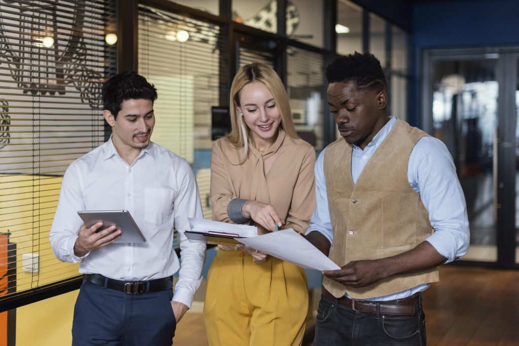 Business professionals reviewing equipment leasing documents